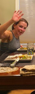 Waving hello at the dinner table, Stephanie the host of healthy menu